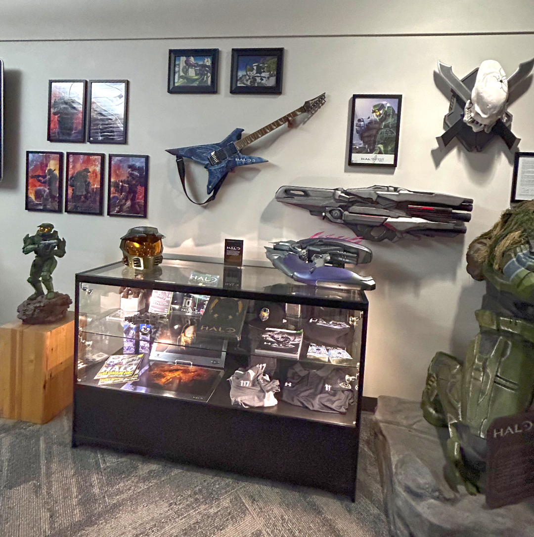 Wall with Halo incineration cannon, a Needler, and a guitar