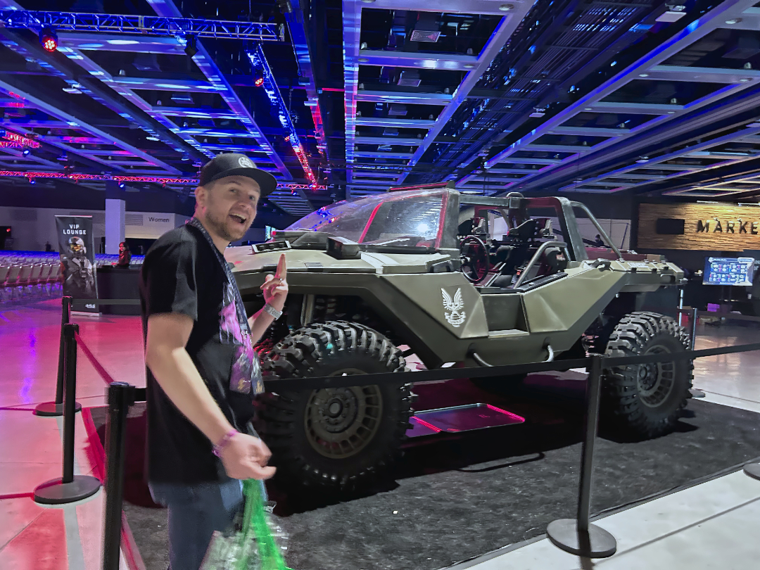 Me being _really_ happy next to a Warthog model (I think it can actually drive).