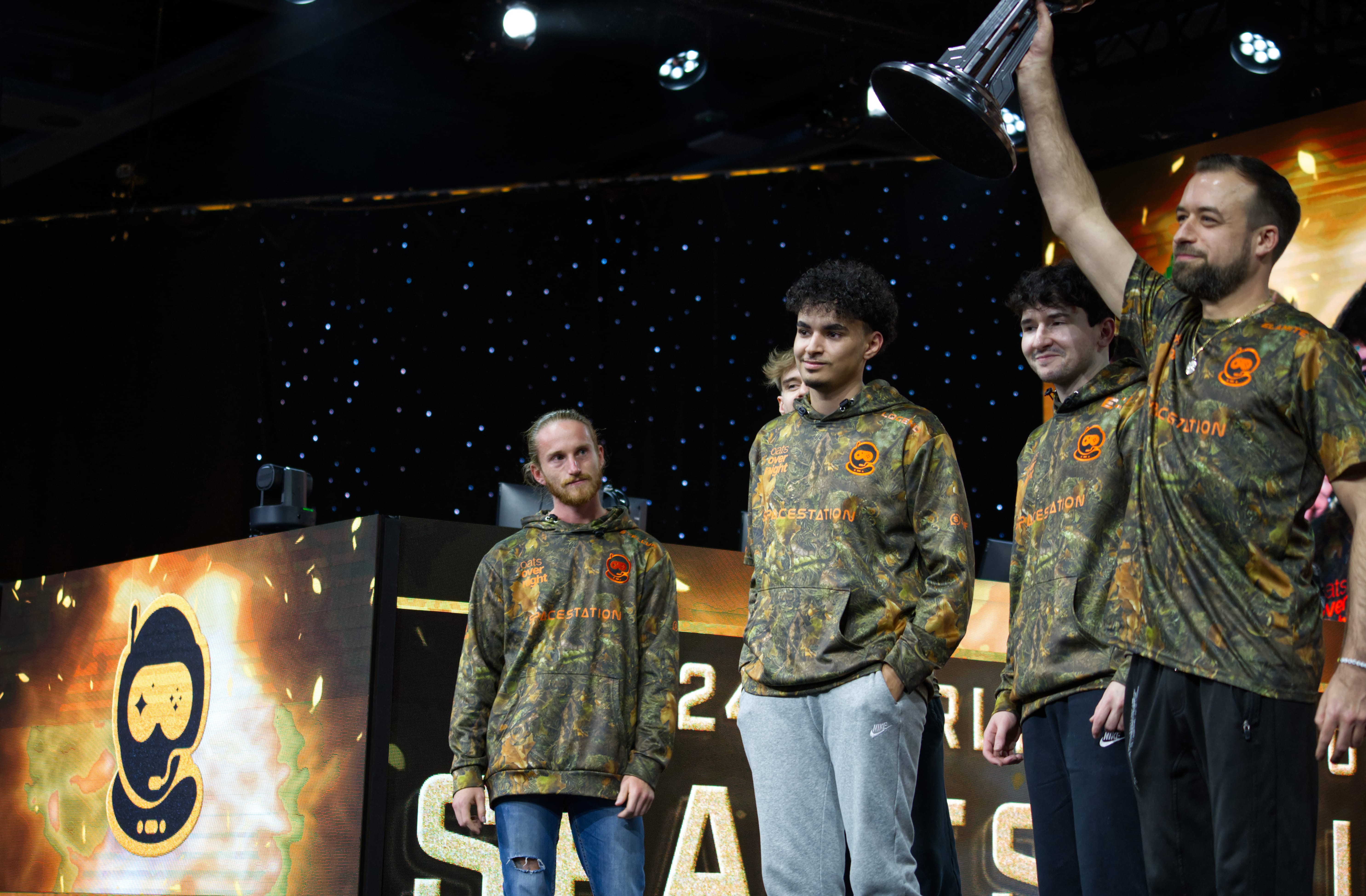 Elamite holding up the Halo World Championship trophy.