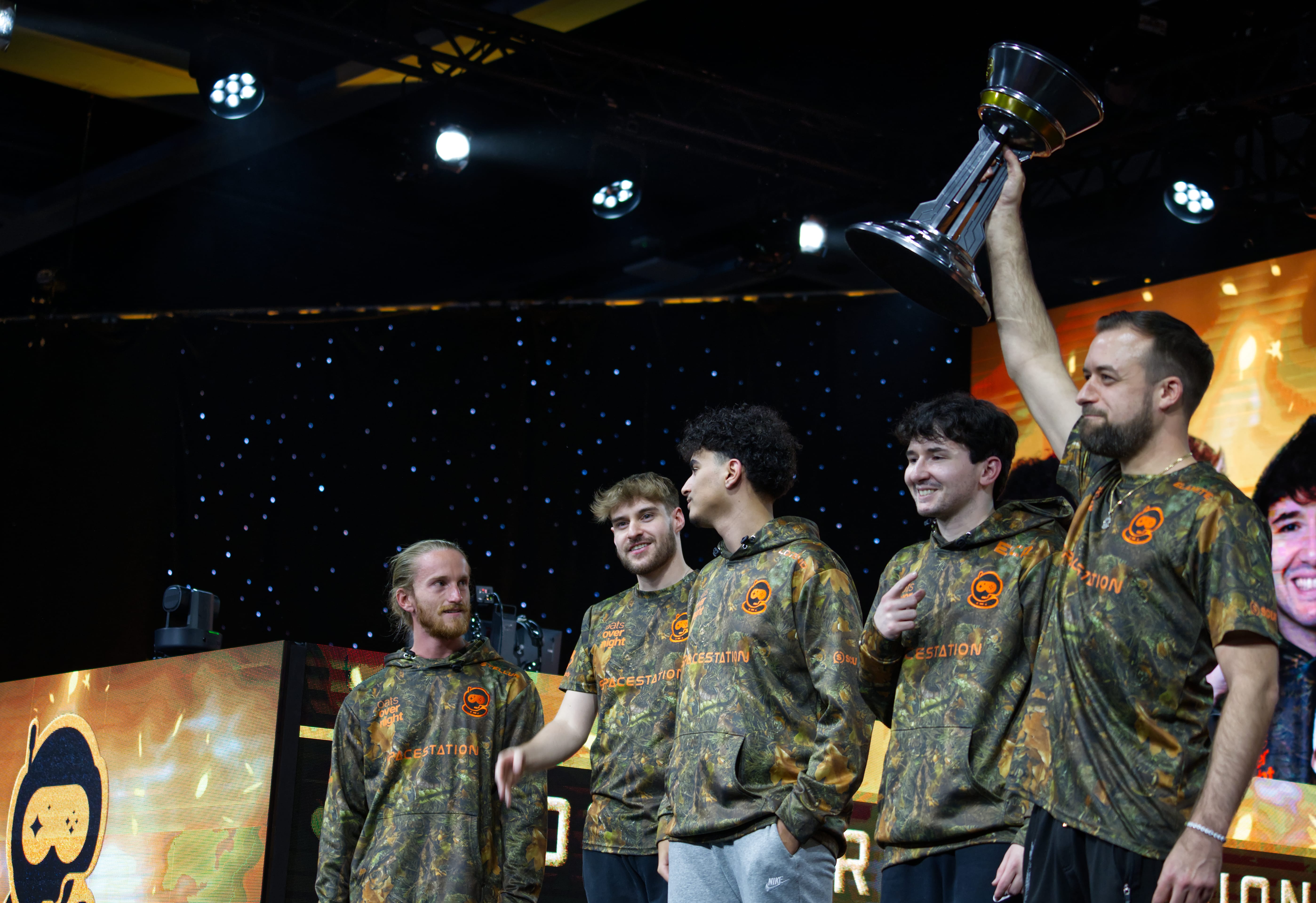 Elamite holding up the Halo World Championship trophy.