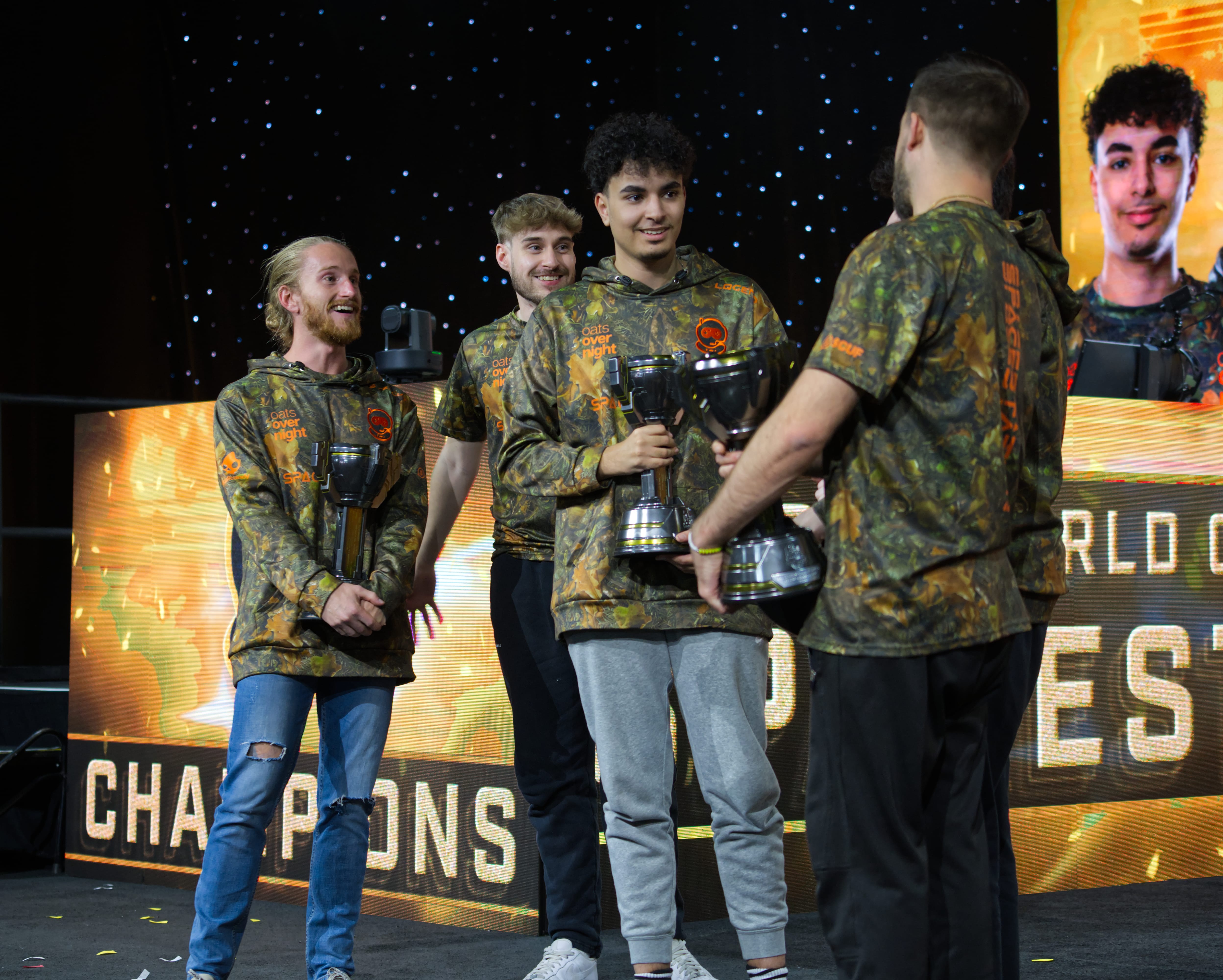 Elamite entertaining his team on stage.