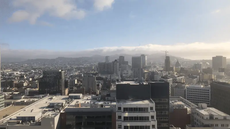Fog rolling over San Francisco, with Sutro Tower peeking through.