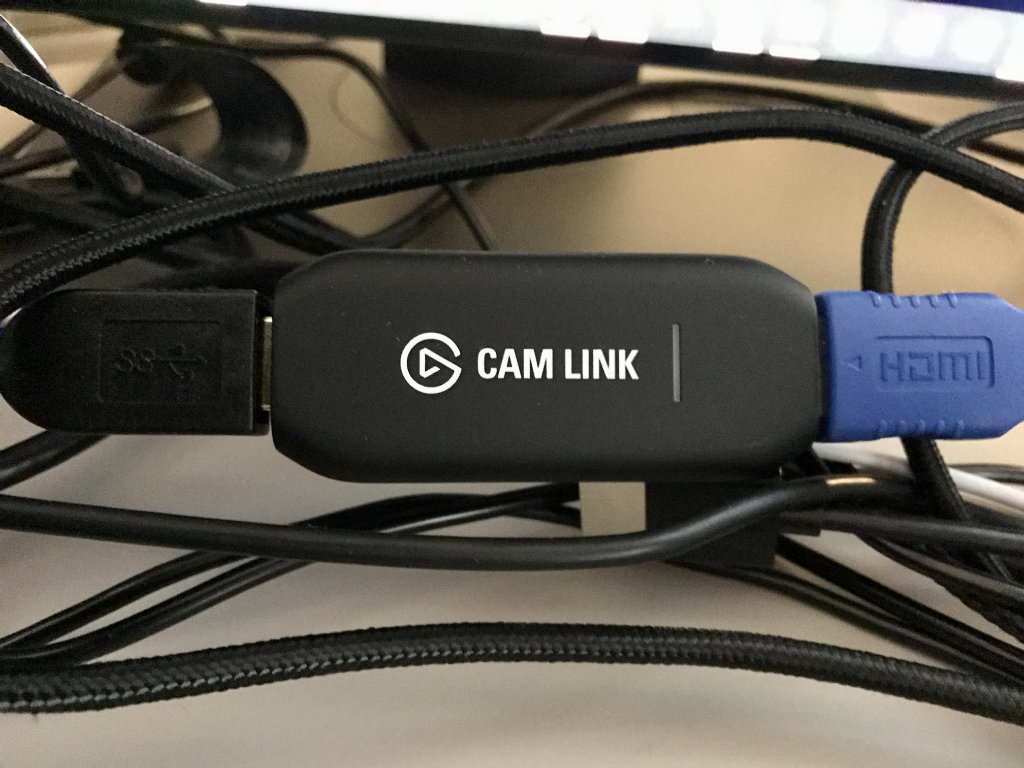 An Elgato Cam Link device connected to USB and HDMI