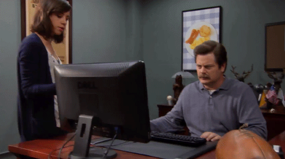 Ron Swanson throwing computer in trash