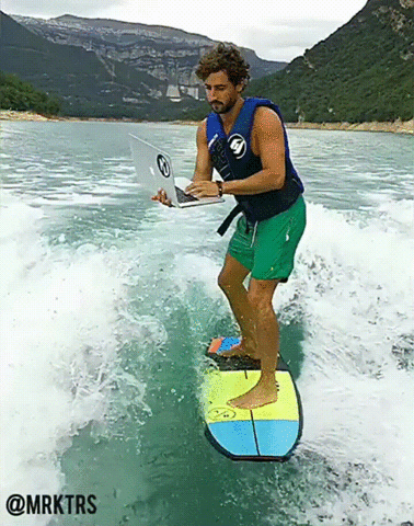A GIF of a person surfing with their laptop