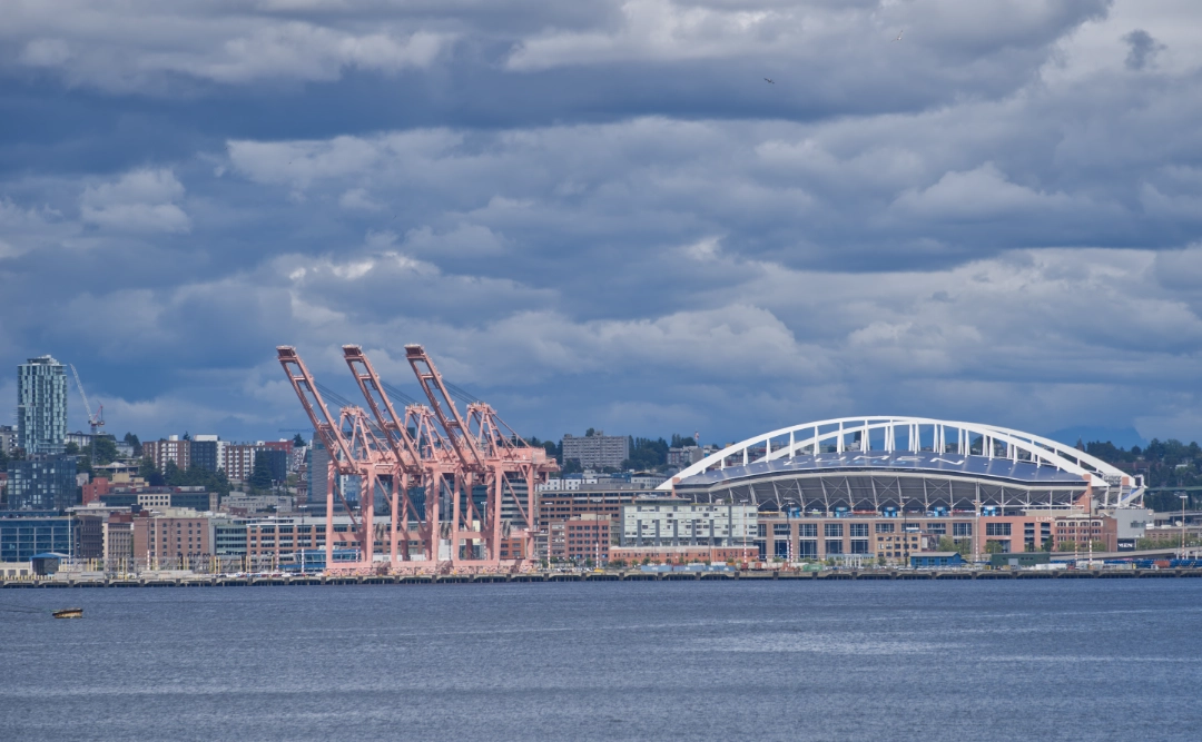 Close-up of the Port of Seattle and Lumen Field from Alki Beach.